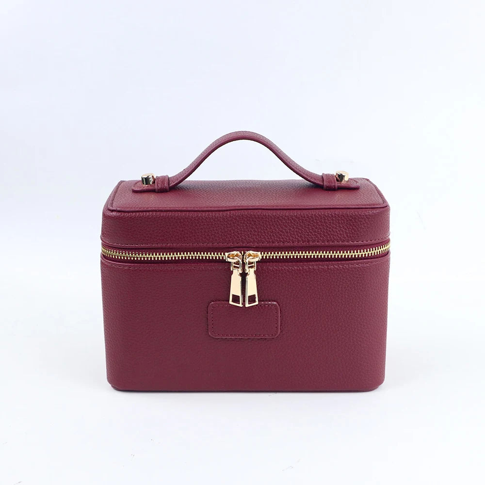 Customized name PU leather makeup bag with compartmentalized storage design, large capacity, and includes a makeup bag.