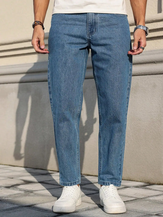 Men's jeans are made of classic blue denim fabric with a loose fit, making them an indispensable versatile item in the wardrobe.