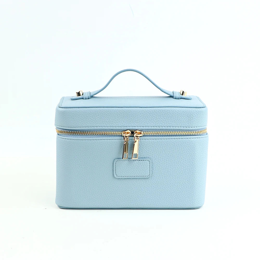 Customized name PU leather makeup bag with compartmentalized storage design, large capacity, and includes a makeup bag.